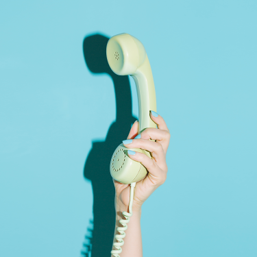 Hand holding a phone receiver